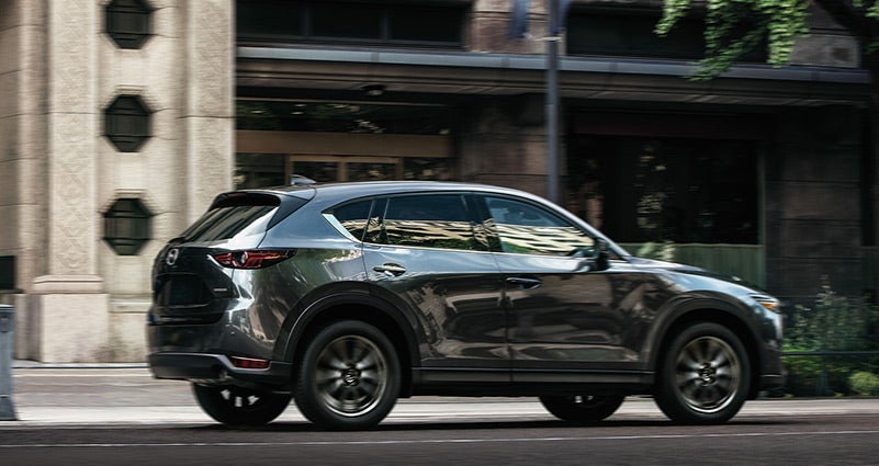Grey 2020 Mazda CX-5 Driving on the road | Bommarito Mazda South County in St. Louis, MO