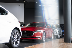A lineup of Mazdas with a red 2021 Mazda3 front and center. | Mazda Dealer in St. Louis, MO